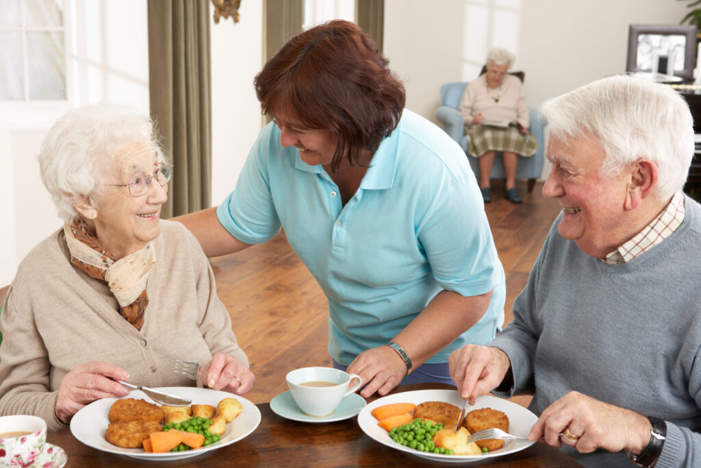 Eldery couple with food full of their nutritional needs