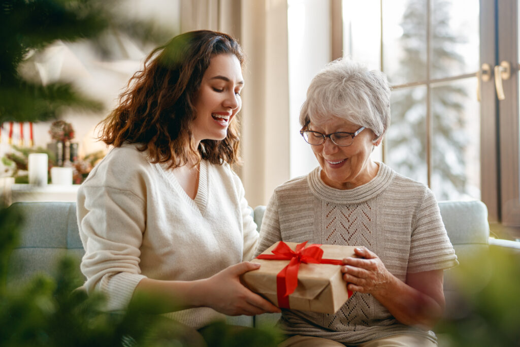 Daughter and senior mother celebrating Christmas