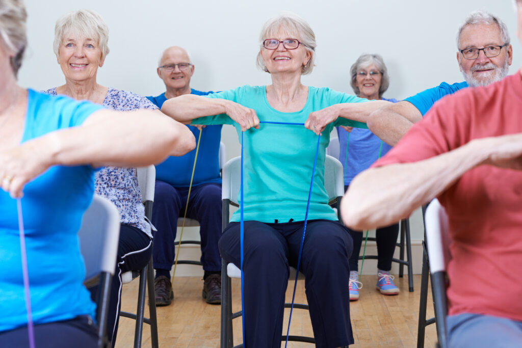 Seniors exercising while sitting