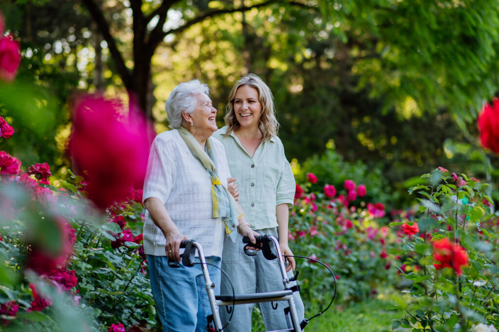 senior women walking with younger women in the summer