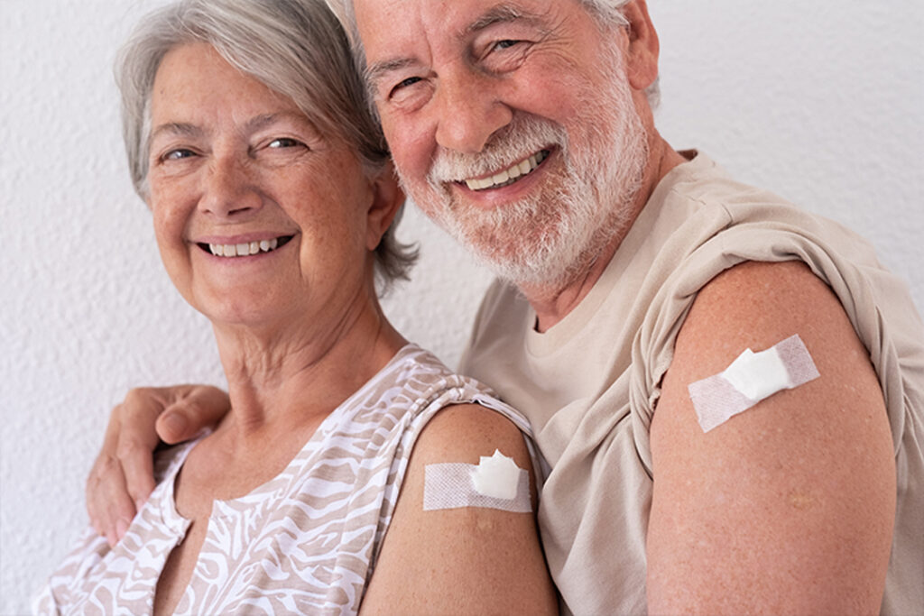 happy senior couple who just received immunization shot 