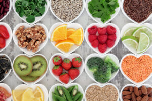 Variety of fruits, vegetables, nuts, and seeds representing a healthy diet for seniors